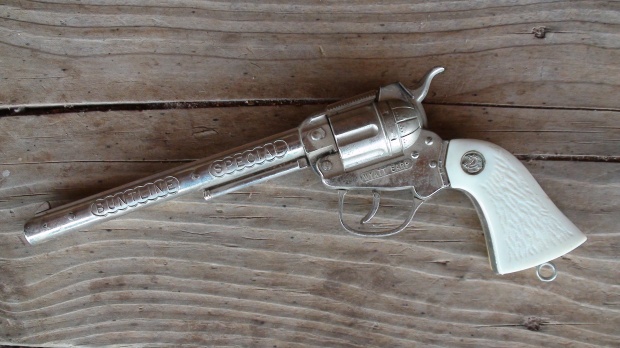 A toy gun made to look like an old western pistol. http://www.westerntoyguns.com/?page_id=630